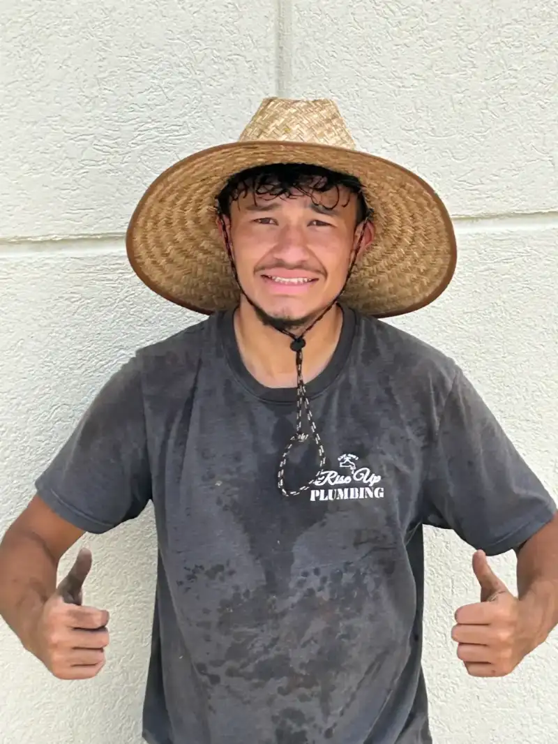 Rise Up Plumbing Employee Working Hard